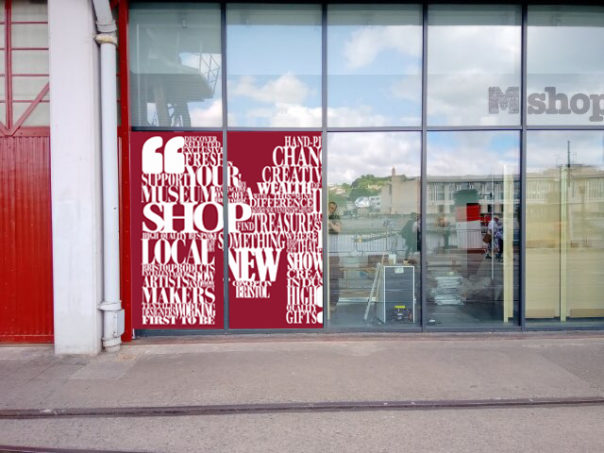 Photo showing what the draft graphic will look like on the outer window - a giant M from our style guide