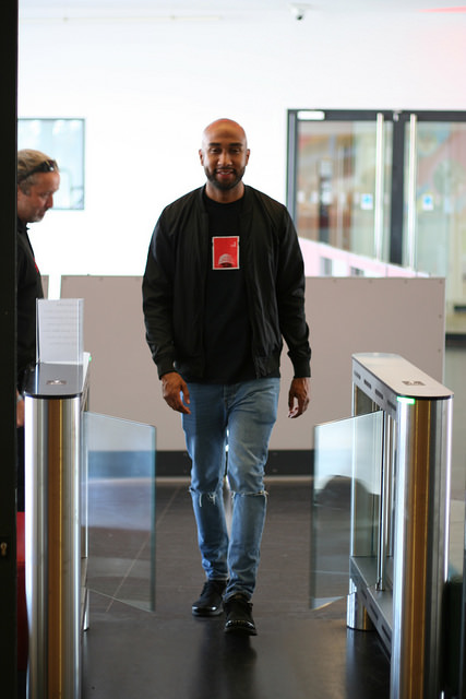 Photo of a visitor entering the exhibition through the barrier