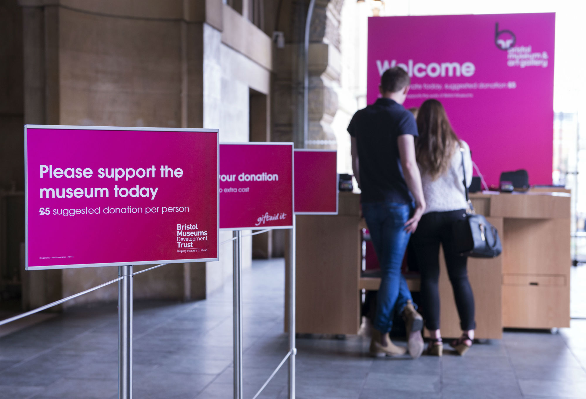 Photo showing our new welcome area with the public at the desk